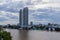 Bangkok, Thailand - July 8, 2017: High rise hotel building at the right-hand side of the `Chao Pra Ya` river in the evening.