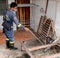 BANGKOK, THAILAND - JUNE 29, 2020 : rescuer uses snake tongs equipment to catch a reticulated python