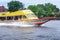 BANGKOK, THAILAND - JUNE 29: Public ferry number 180 speeds along Chaophraya river with passengers in Bangkok on June 29, 2019