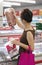 BANGKOK, THAILAND - MARCH 01: Unnamed woman shops in the frozen section of the supermarket Makro on Petchkasem in Bangkok on March