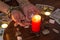 Bangkok,Thailand,March.15.20.The girl holds wedding rings on her hand with Tarot cards with heart,crystals,a magic ball and a