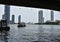 BANGKOK, THAILAND March 19, 2019 Asian boat on the Chao Phraya river in Bangkok and some skyscrapers