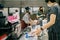 Bangkok, Thailand - March 31, 2020 : asian woman shoppers and cashier are wearing hygiene face mask to protect from coronavirus