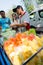 Bangkok, Thailand : Market man selling fruits.