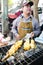 Bangkok, Thailand : Market man selling grilled squ