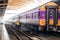 Bangkok, Thailand - May 25, 2019: An employee washes a railway passenger car at Hua Lamphong, A group of workers washes