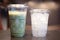 Bangkok, Thailand - November 21, 2020 : Cup of iced green tea latte and ice in glass at Starbucks Coffee shop