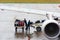 BANGKOK, THAILAND - NOVEMBER 28, 2016: Airport workers load baggage into the plane. Copy space.