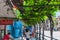 Bangkok, Thailand - November 29 2019: Pedestrians walking along shaded side walk in bangkok