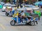 BANGKOK, THAILAND - OCTOBER 2, 2016:A three wheeled tuk tuk taxi on a street in the Thai capital on October 2, 2016 in Bangkok, Th