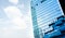 Bangkok, Thailand - September 27 2019: Team worker staff is cleaning the glass on the high building, copy space background for