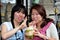 Bangkokl Thailand: Asian Women Drinking Coconut Milk