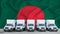 Bangladesh flag in the background. Five new white trucks are parked in the parking lot. Truck, transport, freight transport.