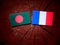 Bangladesh flag with French flag on a tree stump isolated