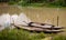 Bangladesh is a riverine country. A calm clear beautiful small river. There are two boats tied up at the wharf