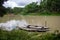 Bangladesh is a riverine country. A quiet beautiful small river. There are two boats tied up at the wharf