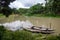 Bangladesh is a riverine country. A quiet beautiful small river. There are two boats tied up at the wharf