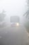 Bangladesh â€“ January 06, 2014: On a foggy winter morning, a bus is passing through the foggy streets and slows traffic at