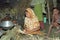 Bangladeshi woman during cooking in primitive hut