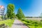 Bank of the Czos lake and walking and cycling path at summer  time