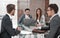 Bank employees work with customers at the Desk.