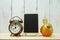 Bank empty wooden easel with alarm clock with bird Stucco doll decoration