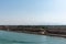 Bank of the Suez Canal, panorama view from transiting cargo ship.