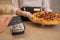 Bank terminal payment by wireless card for pizza services, takeaway food