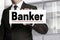 Banker sign is held by businessman concept