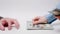 Banking service. Woman fast count out money while man is impatiently waiting for payment. Close-up of hands on white