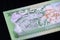 Banknote five Fijian dollars on a dark background