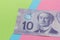 Banknotes of Canadian currency: Dollar. Bills on colorful bright
