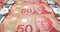 Banknotes of fifty canadian dollars rolling on screen, cash money, loop