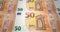 Banknotes fifty euros passing on screen