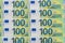 Banknotes of one hundred and 100 euros are in exactly two rows. Blank for design, background. European currency,