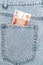banknotes in the pocket of blue jeans. russian 5000 banknote