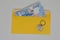 banknotes in a yellow envelope. open envelope with banknotes on a light background. envelope with banknotes. close up of