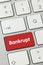 Bankrupt - Inscription on Red Keyboard Key