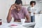 Bankrupt man in financial stress reading eviction notification while wife reading bills