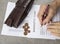 Bankruptcy concept image of a pen, calculator and coins on financial documents