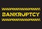 Bankruptcy distress sign. Broken yellow font text. Concept of economy recession or business crisis
