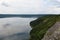 The banks of a large river with smooth calm water.The panoramic landscape of Bakota Bay view. Dniester river, Ukraine.