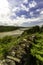 Banks of river in North Wales with railway bridge, dry stone wall