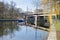 Banks of the river Spree with the steel railway bridge Bellevue and a police boat in Berlin, Germany