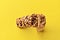 Banner bar granola stand upright on a yellow background in the center view from above with a copy space