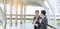 Banner Businessman Businesswoman drink coffee in town outside office modern city. Panoramic Hands holding take away coffee cup