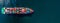 banner captures cargo container ship sailing across ocean, loaded with containers, freight shipping