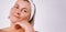 Banner. Caucasian senior woman wearing white headband bandage with clean and moisturized skin after homemade skin care