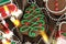 Banner for Christmas and New Year gingerbread. Christmas trees, toys, snowmen, garlands on a background of brown silk