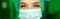 Banner: Close face view of female doctor in surgical mask looking at you